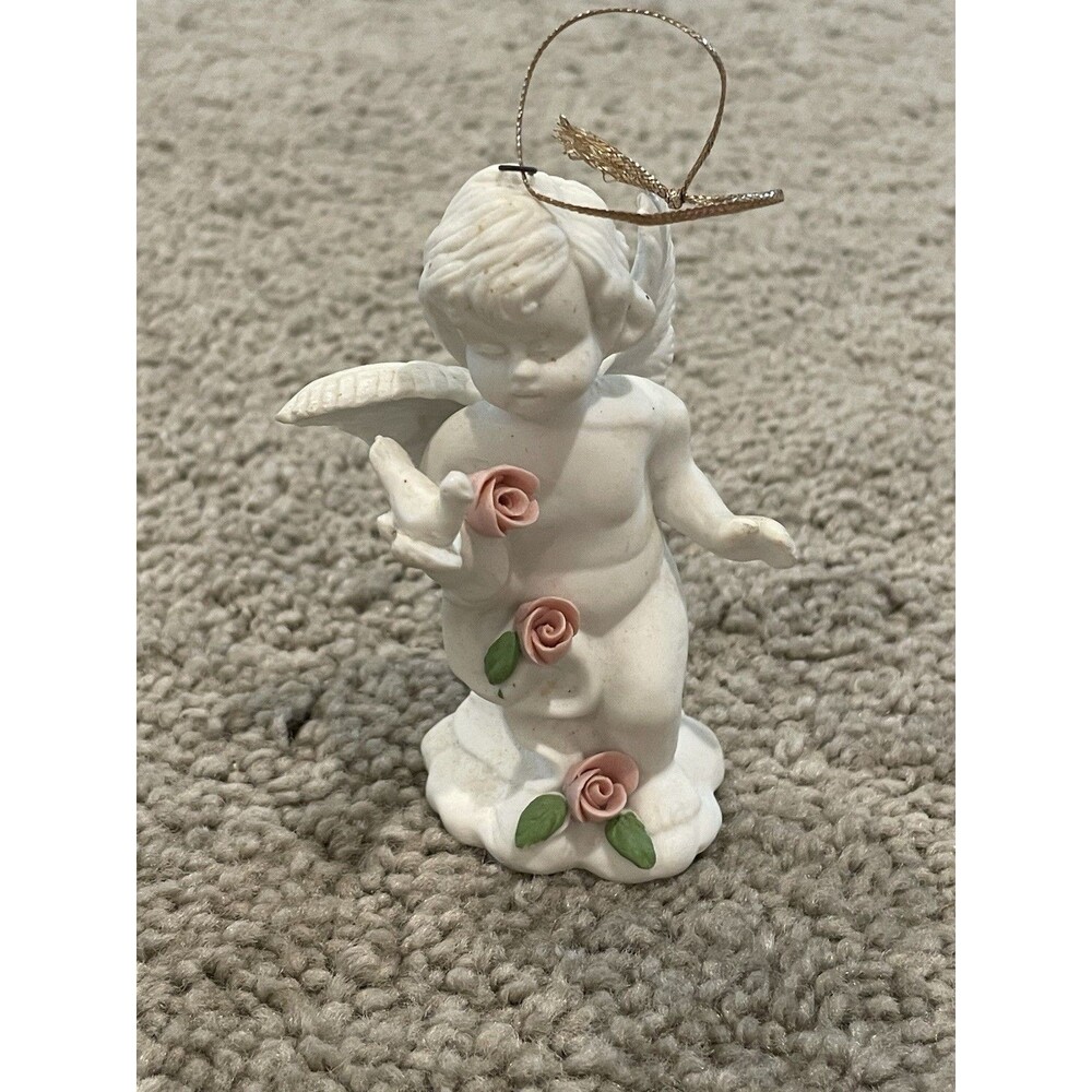 WHITE PORCELAIN ANGEL W/ 3 PORCELAIN ROSES HOLDING A DOVE ORNAMENT